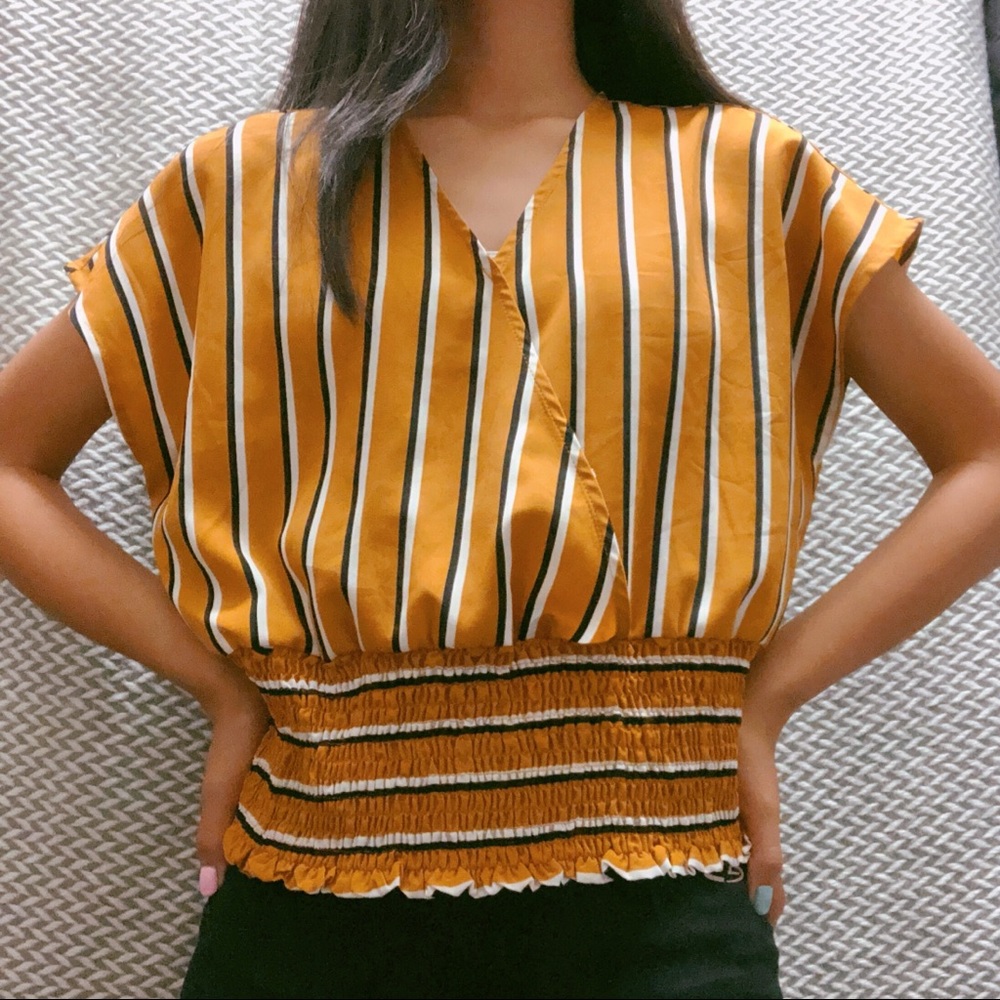 slightly worn lipslide mustard striped top